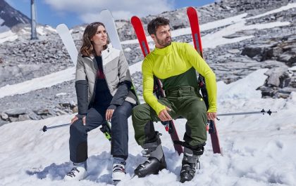 pareja en la nieve con ropa de ski