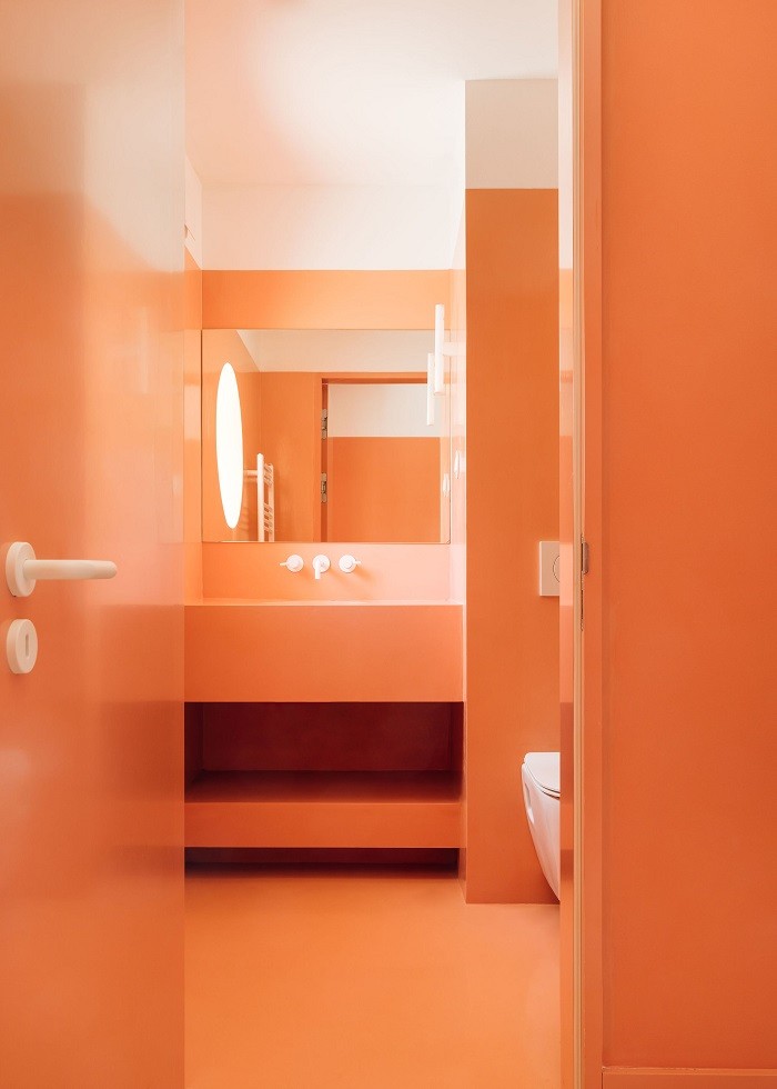 diseño HIMACS cuarto de baño naranja de apartamento