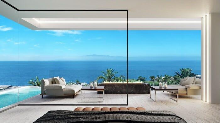 Proyecto de interiorismo con un salón de lujo con vistas al mar en Canarias