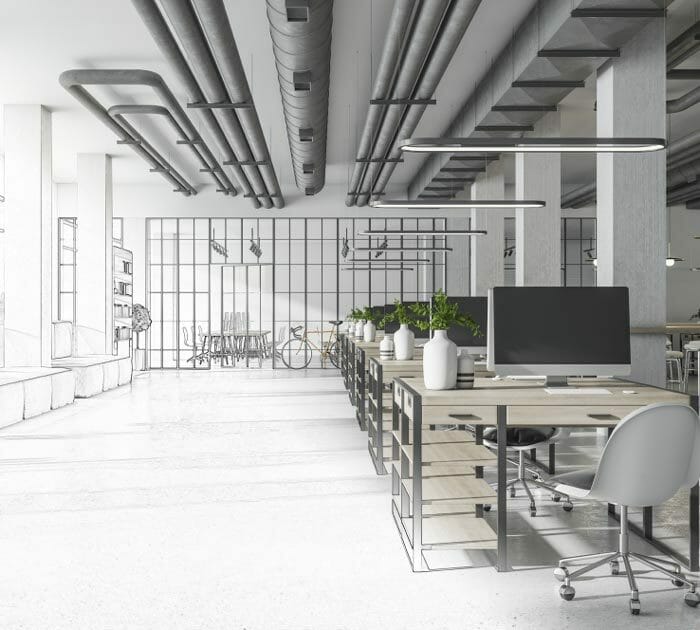 Espacio de una oficina moderna con tubos en el techo de aire